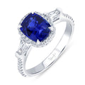 18K White Gold Three Stone Oval Blue Sapphire, Tapered Baguette and Round Diamond Ring