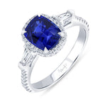 18K White Gold Three Stone Oval Blue Sapphire, Tapered Baguette and Round Diamond Ring